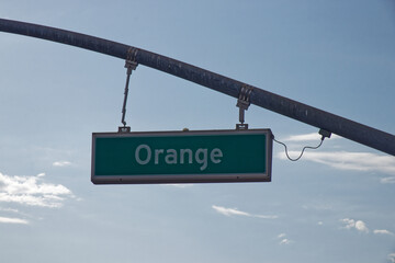 Green Orange Street Sign in the Blue Sky © MarekLuthardt