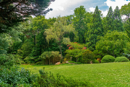 Expansive Lunar Lawn opens toward mature trees at Hillwood Estate in Washington.