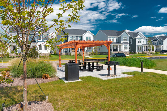 Wooden pergola with picnic tables serves a new residential community in Leesburg, Virginia.