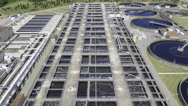 Aerial view of aeration basins at a large Metro Water Services wastewater treatment facility with circular clarifiers and industrial infrastructure in Nashville, Tennessee, United States.