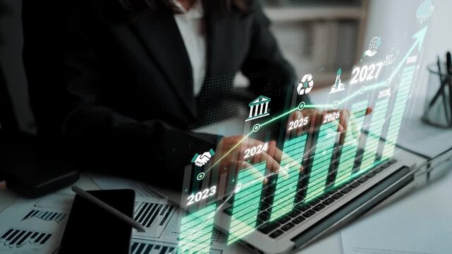 Business professional analyzing financial growth with digital charts and projections for future years in modern office setting Sigmoid