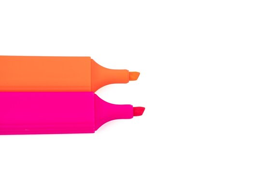 Pink and orange fluorescent highlighter marker pens isolated on a white background
