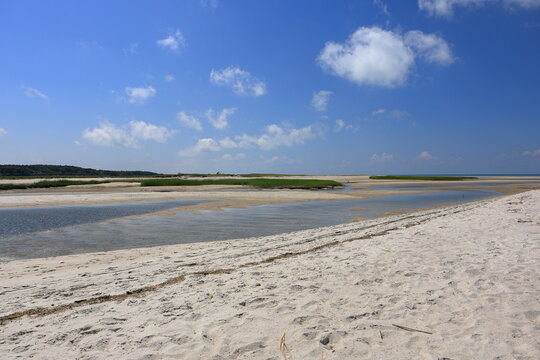Estuary reveals white sands and tide pools along the tidal flats of Cape Cod