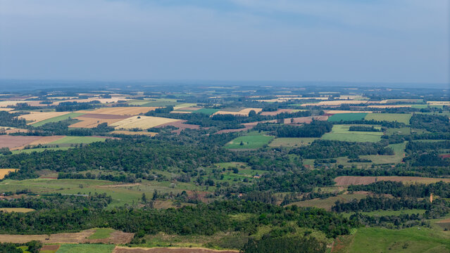 Aerial view of agricultural fields, forests, and rural landscape in Nueva Alborada, Itapua Department, Paraguay.