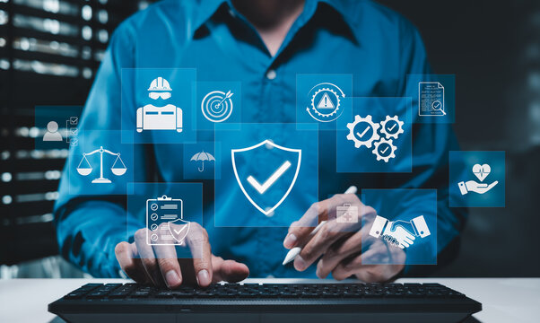 Workplace safety and industrial compliance concept. Person typing on keyboard with shield checkmark icon, occupational health insurance, worker protection, hazard risk control, audit regulations