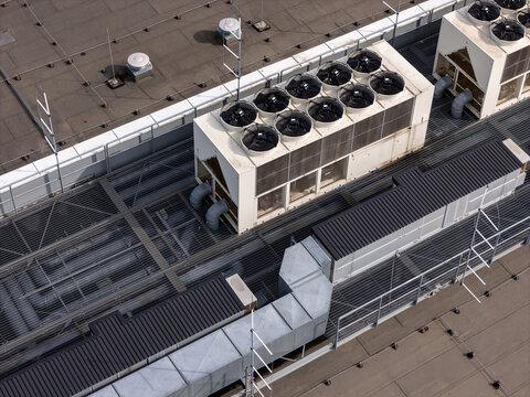 Aerial view of industrial HVAC units and ventilation systems installed on a flat commercial rooftop in Gdansk, Poland.