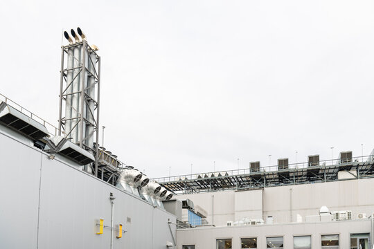 exterior of a modern data center. an industrial production complex featuring ventilation stacks and air conditioning units.