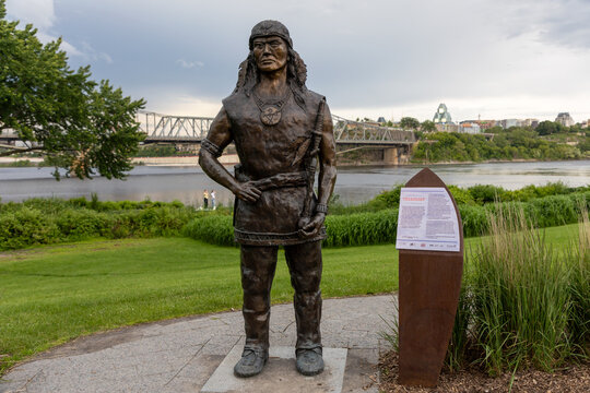 Gatineau, Canada - June 20, 2026: Bronze statue of Algonquin Chief Tessouat near Canadian Museum of History. Indigenous chief monument overlooking Ottawa River and Alexandra Bridge