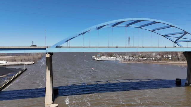 Pulling shot Aerial of leo frigo bridge in early spring over the fox river green bay wisconsin.