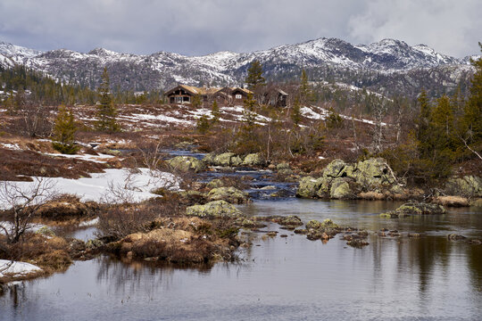 Norefjell Mountain Landscape with River and Cabins in Spring