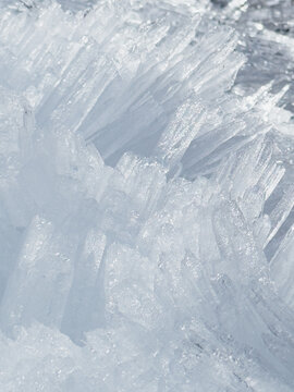 Abstract winter background with sharp frozen ice crystals and shards
