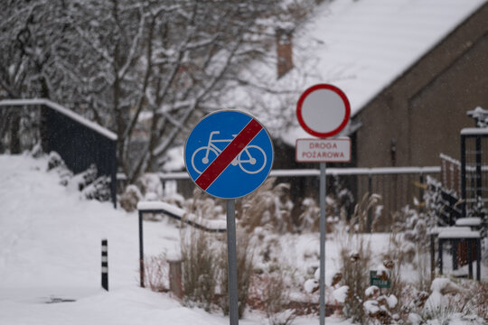 Snow Covered Emergency Access Road and No Bicycles Sign in Winter