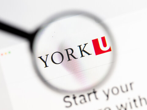 Milan, Italy 2026, 15 AGO Closeup of York University Canada website page on a laptop screen. Focus on York University Canada logo under a magnifying glass.