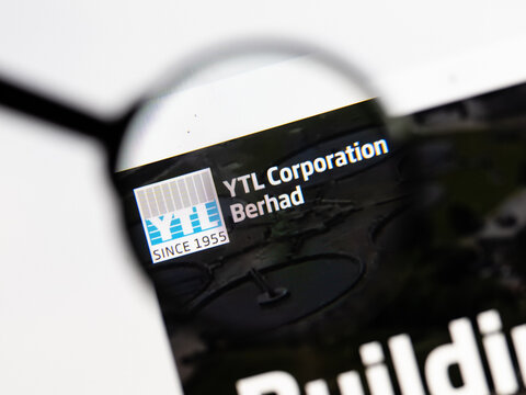 Milan, Italy 2026, 15 AGO Closeup of YTL Corporation website page on a laptop screen. Focus on YTL Corporation logo under a magnifying glass.