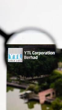 Milan, Italy 2026, 15 AGO Closeup of YTL Corporation website page on a laptop screen. Focus on YTL Corporation logo under a magnifying glass.