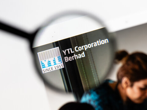 Milan, Italy 2026, 15 AGO Closeup of YTL Corporation website page on a laptop screen. Focus on YTL Corporation logo under a magnifying glass.
