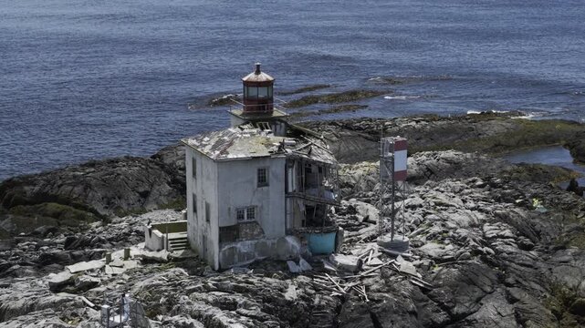 Derelict Gull Rock Lighthouse bestrides a guano encrusted Atlantic rock outcropping 5km south of picturesque fishing village Lockeport, Nova Scotia Canada. MAX QUAL PRORES422HQ 4K HLG HDR BT.2100
