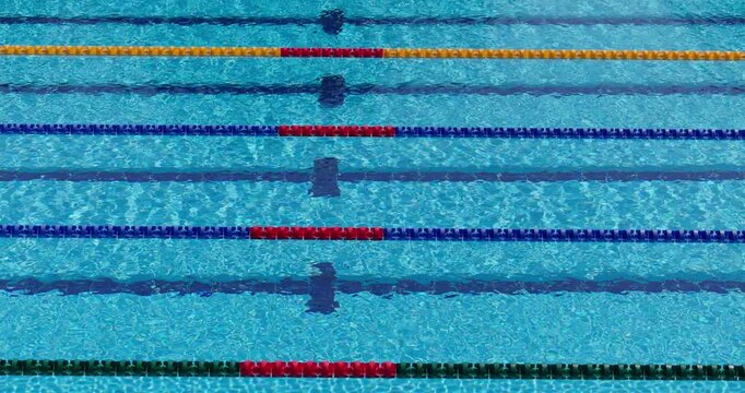 Swimming pool lanes with blue water and lane lines background