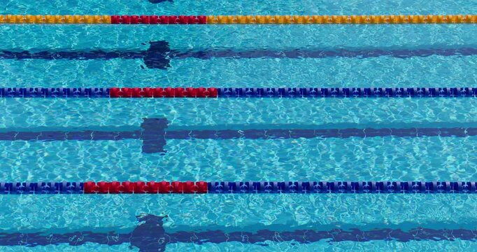 Swimming pool lanes with blue water and lane lines background