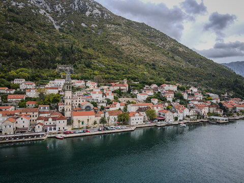 Perast Village and Saint Nicholas Church Bell Tower on Kotor Bay Under Cloudy Sky
