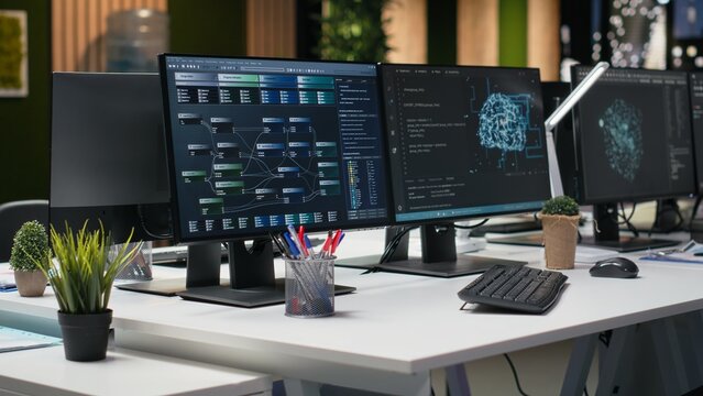 Computer in a Silicon Valley office automates app development with machine learning, helping an empty tech startup workplace accelerate feature implementation.