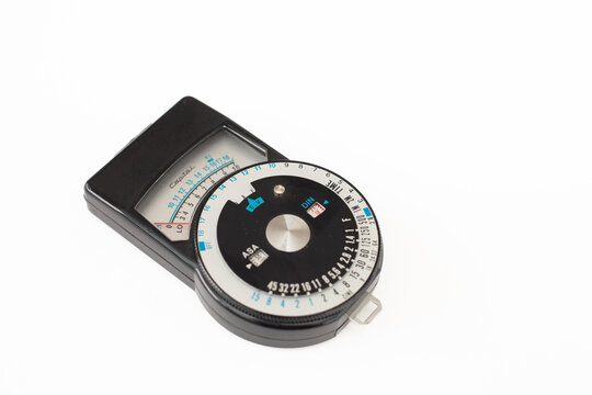 Vintage Capital analog light meter for photography and cinema. Measures the intensity of ambient light to determine the correct exposure. The rotating discs allow calculation of the combination .