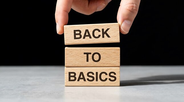 Hand Stacking Wooden Blocks with Back to Basics Text for Business Strategy Concept Presentation Banner and Website Pages