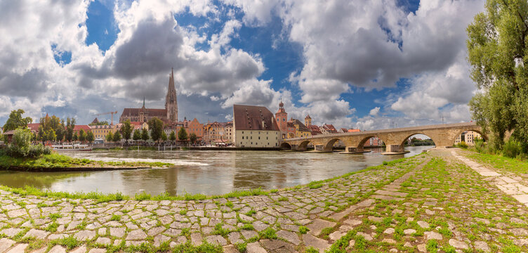 Panoramic view of the Stone Bridge, Danube River and historic architecture in Regensburg, Bavaria, Germany.