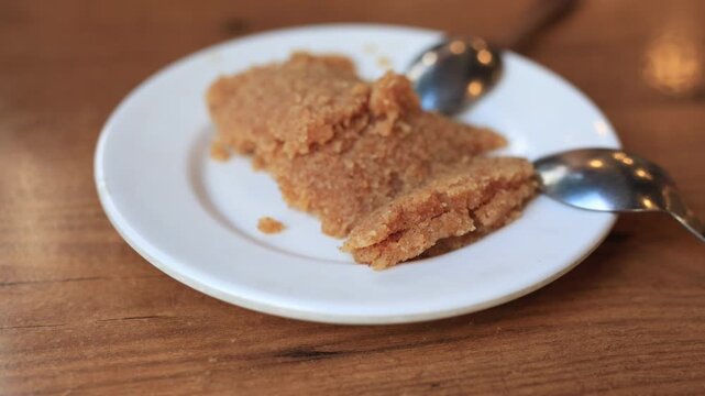Modern plated traditional Turkish flour halva dessert served in a cafe