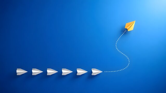 Golden paper airplane changing direction and breaking away from a line of white planes on blue background representing leadership and unique business strategy