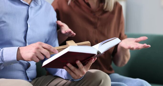 Pastor conducting Bible study with senior woman at home, closeup