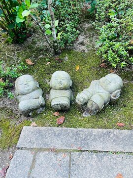 Three Little Jizo Statues Resting Together