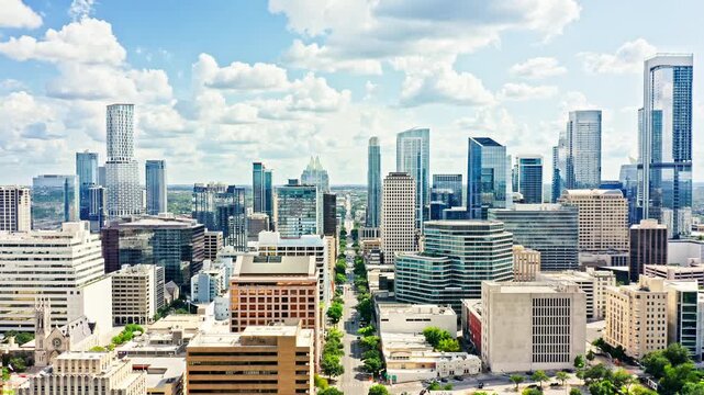 Aerial establishing shot of Austin, Texas skyline with forward camera motion along Congress Avenue towards the skyline. Austin is the capital city of the U.S. state of Texas.