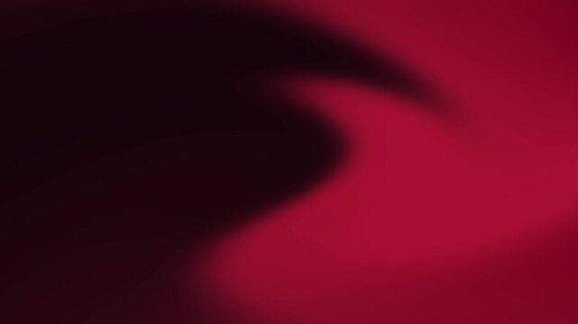 Deep burgundy and black abstract gradient animation with a broad flowing curve and restrained cinematic color palette