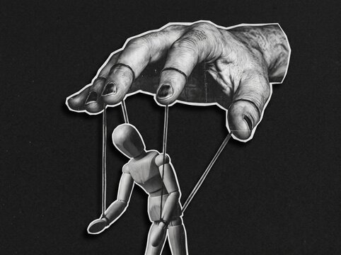 Surreal Collage Concept of a Large Hand Manipulating a Wooden Marionette Puppet