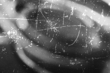 Monochromatic film grain texture with dust scratches and vintage analog photography overlay