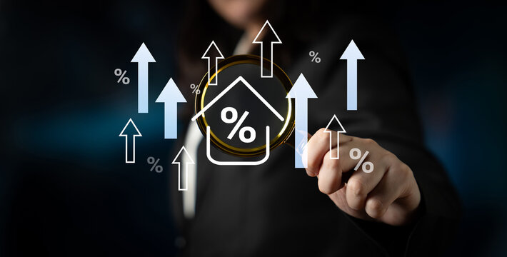 A businesswoman demonstrates financial growth concepts with upward arrows and percentage symbols, representing success and opportunities in real estate markets. Gantry