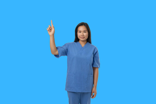 A medical worker raises a hand in a blue space
