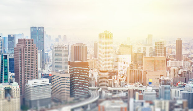 Aerial view of osaka city skyline with skyscrapers and blurred foreground in Japan, tilt shift effect