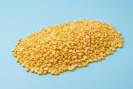 Generated ai Golden Split Mung Beans Pile Displayed on Clean Cyan Background for Healthy Culinary Design