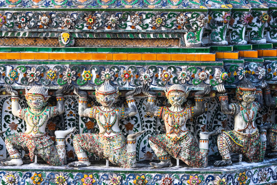 Wat Arun temple guardian statues in Bangkok, Thailand