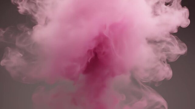 Pink smoke explosion expanding in a subtle studio setting with soft lighting and dramatic motion