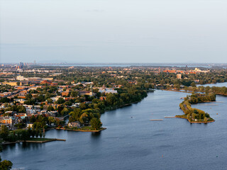 Obraz premium Aerial view of Rene-Levesque Park lighthouse peninsula in Lachine, Montreal along St Lawrence River at sunset. g.