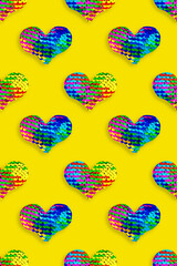 Creative pattern of colored hearts of sparkling sequins, blue red purple yellow colors. 14 february Valentines day holiday graphics, festive concept, pop art style, shiny sequins heart as fish scale. © yrabota
