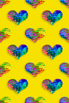 Creative pattern of colored hearts of sparkling sequins, blue red purple yellow colors. 14 february Valentines day holiday graphics, festive concept, pop art style, shiny sequins heart as fish scale.