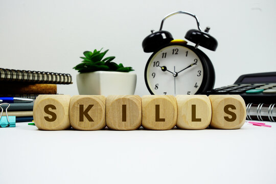 SKILLS alphabet letters with alarm clock and calculator on white background