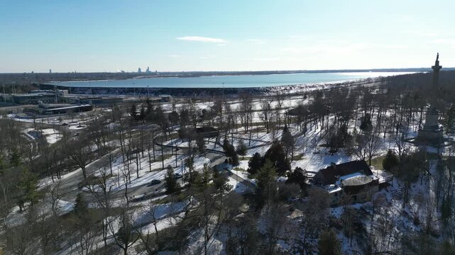 Aerial over Queenston, Ontario, Canada during winter, March 2023. Rising, Queenston Heights and Brock's Monument, with the Sir Adam Beck Hydroelectric Station Reservoir in the background.