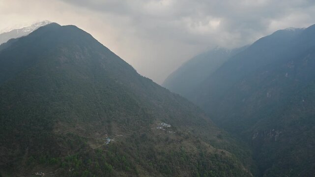 An environment of Chomrong village in Nepal covered by cloudy. The village sits on a high ridge above the Modi Khola valley in Annapurna conservation area.