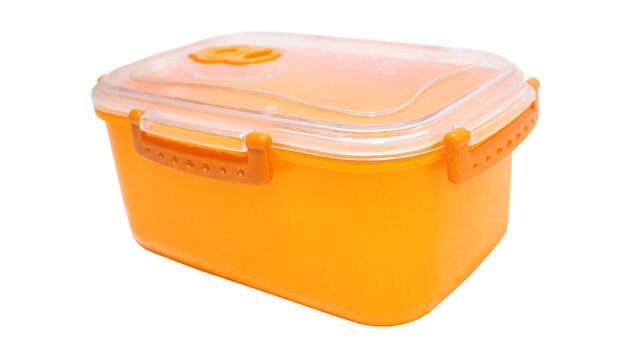 Side view of empty orange airtight plastic food container with clear lid isolated