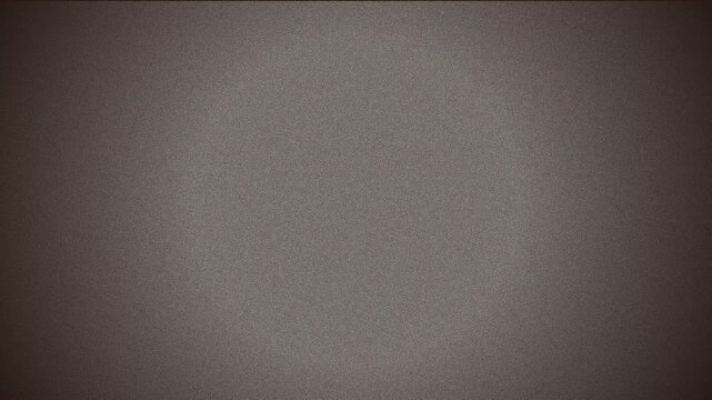 Analog television static screen with white noise grain texture creating vintage broadcast disruption effect in this dynamic motion video clip